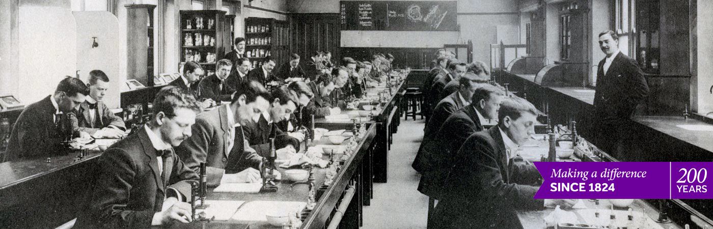 students working in pathology lab, 1900